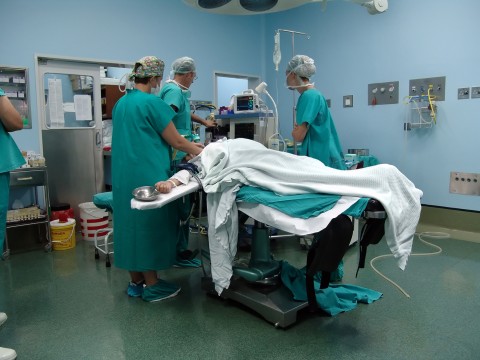 a C-section underway in an operating room