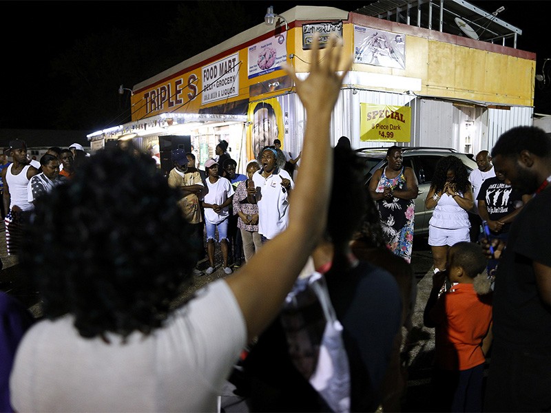 people gathered outside a store